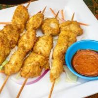 Chicken Satay (4 Skewers) · Cubes of white meat chicken marinated in yellow curry served on a skewer.