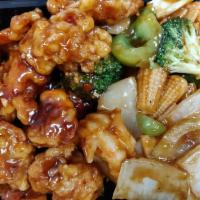 S7. Dragon and Phoenix · General Tso's chicken and shrimp with mixed vegetables. Served with steamed white rice.