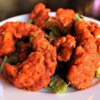 Buffalo Chicken Fingers · Kick it up with six fried and juicy chicken tenderloins dredged in our house-made spicy buff...
