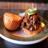 Venison Sloppy Joe Slider · Get messy! Slow braised venison with spiced bbq, jalapeño and pickles on a toasted mini brio...