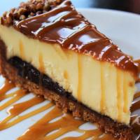 Turtle Cheese Cake · Creamy NY style cheesecake with a graham cracker crust and loads of caramel, chocolate and t...