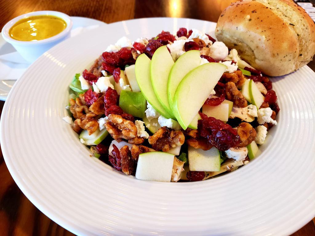 Orchard Chicken Salad  · Roasted chicken breast, Granny Smith apples, glazed walnuts, craisins, goat cheese, chopped iceberg, romaine and spring mix.