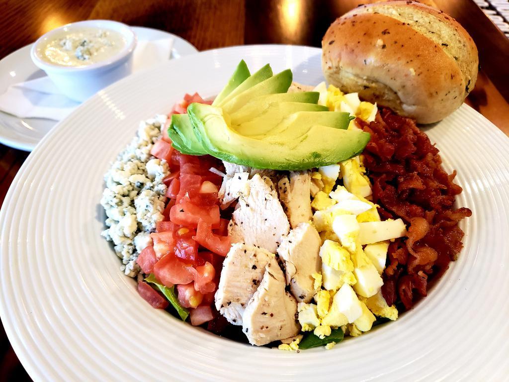 Canyon Cobb Salad  · Iceberg and romaine blend with roasted chicken breast, smoked bacon, boiled eggs, tomato, avocado, and crumbled blue cheese. 
