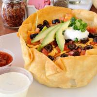 Taco Salad  · Iceberg and romaine in a flour tortilla bowl with your choice of taco beef or roasted chicke...