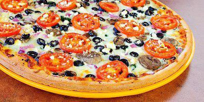 Large Garden Primavera Pizza · Honey wheat crust with mozzarella, Asiago, and feta cheese, spinach, mushrooms, red onions, black olives, and Roma tomatoes on our classic sauce.
