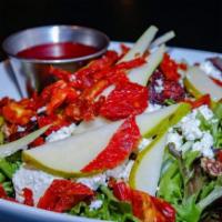 Nature’s Grill Pear Salad · Mesculin greens, dried cranberries, walnuts, sun-dried tomato, goat cheese and sweet pear to...