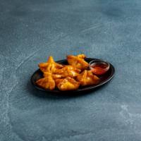 A9. Six Pieces Crab Rangoon · Wonton stuffed with cream cheese, scallion, crab meat and deep fried served with sauce.