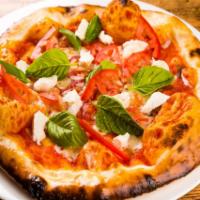 Margherita Pizza · Tomato, Mozzarella and basil. Cooked in brick oven.