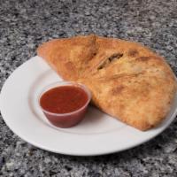 Sausage, Pepper and Red Onion Classic Calzone · Italian sausage, green peppers, red onions, marinara and mozzarella.