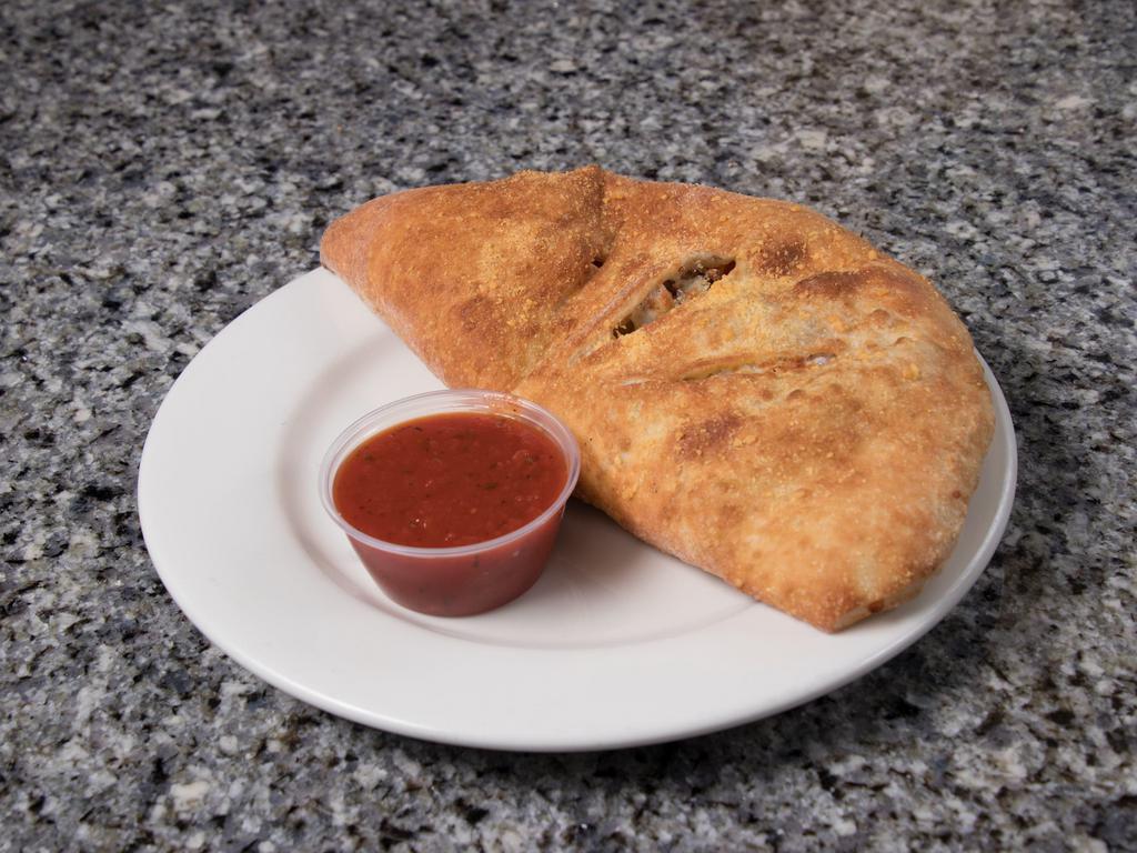 Sausage, Pepper and Red Onion Classic Calzone · Italian sausage, green peppers, red onions, marinara and mozzarella.