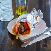 Kafta Kabob Pita Sandwich · Ground beef seasoned with our spice blend, onion and chopped parsley served with tomatoes, p...
