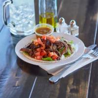 Taco Tri-Tip Beef Shawarma Sandwich · Beef shawarma on soft warm tortilla served with spicy tahini paste, cabbage and tomato salsa...