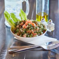 Tabbouleh Salad · A fresh mix of very finely chopped parsley, tomatoes, fresh mint, cracked wheat, and diced o...
