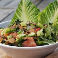 Fattoush Salad · Romaine lettuce, tomatoes, chopped parsley, onions, cucumber, radish and sumac, tossed in fr...