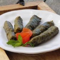 Grape Leaves · 5 pieces. Grape leaves stuffed with seasoned rice and medley of fresh vegetables. Vegan. Veg...