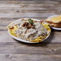 Country Omelette Breakfast · Sausage, grilled onions, potatoes and American cheese topped with gravy. Made with 3 extra l...
