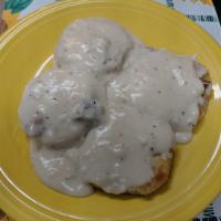 Biscuits and Gravy · 2 open-faced biscuits smothered in a creamy sausage gravy.