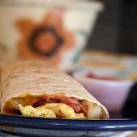 Breakfast Burrito · Large tortilla stuffed with scrambled eggs, bacon pieces, diced potatoes, onions, cheddar ch...