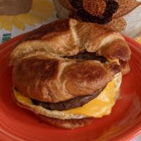 Croissant Breakfast Sandwich · Breakfast meat, cheese, and egg on a large, flaky croissant.