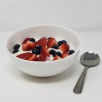 Yogurt Breakfast · Bowl of vanilla yogurt with a choice of topping.