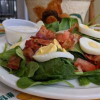 Spinach Bacon Salad Lunch · Medium salad of fresh spinach leaves topped with bacon, sliced egg, and tomato croutons. Cho...