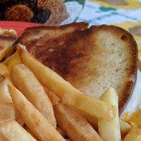 Triple Threat Grilled Cheese Lunch · Melty, creamy layering of American, Provolone, and sharp cheddar cheeses.
