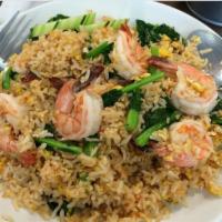 Regular Fried Rice · Fried rice with choice of protein, chinese broccoli, tomatoes, onions, and egg.