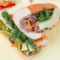 #6. Grilled Pork Sandwich · Foot long sandwich cut in half served with pickled carrot, daikon, radish, cucumber, cilantr...