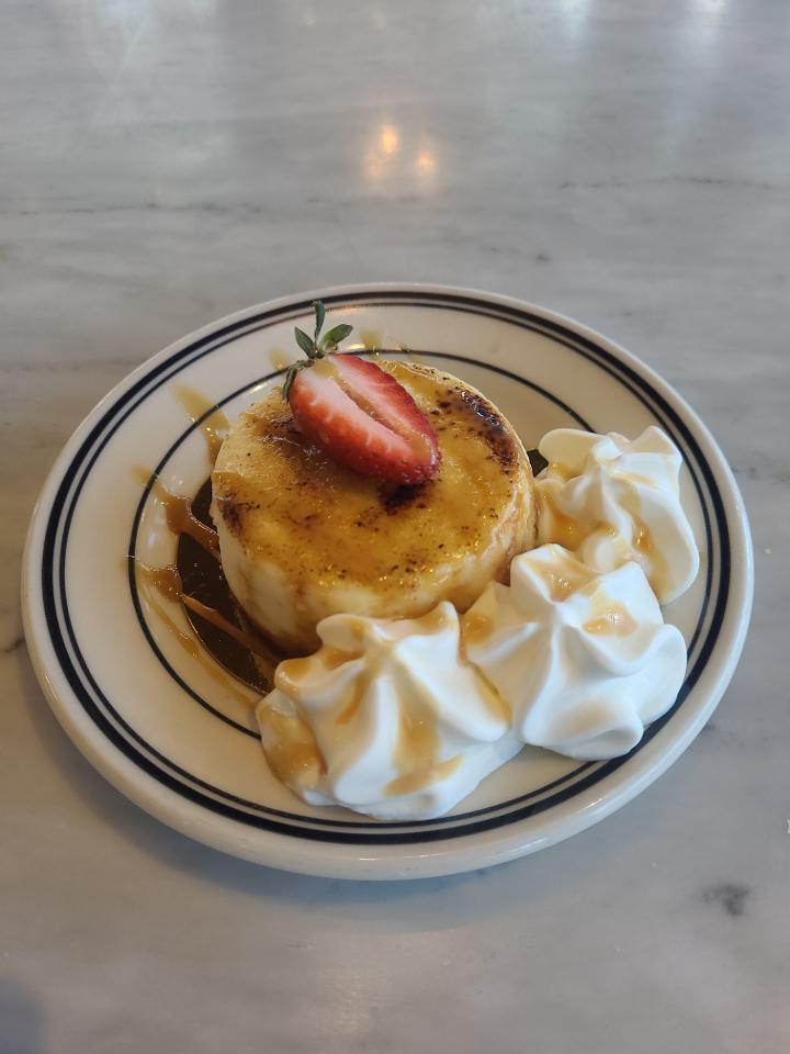 Creme Brûlée Cheesecake · Cookie crust, vanilla bean cheesecake filling tourched sugar crust topping