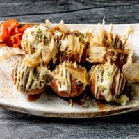 Takoyaki  · Wheat flour-based batter filled with minced octopus and topped with green laver, bonito flak...