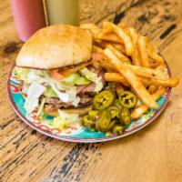 Torta Cubana · Carnitas, ham, cheese, mayonnaise, beans, lettuce, tomatoes and guacamole. Served with fries