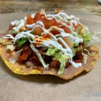 TOSTADAS · Our tostadas are made with beans, cheese, your choice of meat, lettuce, tomato and sour cream