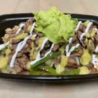 CARNE ASADA BOWL · Rice, grilled tomatoes, peppers, onion and carne asada topped with sour cream and smashed av...