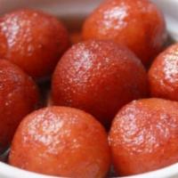 Gulaab Jamun  · Delicate milk balls fried in vegetable oil and soaked in sweet syrup.