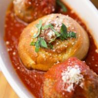 Polpettine · Mini meatballs served with Pecorino cheese, basil and tomato sauce.