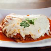 Pollo Fior di Latte · Breaded chicken breast pan-fried and oven-baked with homemade mozzarella and tomato sauce.