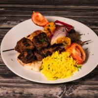 Beef Shish Kabab · Lean and tender beef charcoal grilled. Served with rice and tahini sauce.