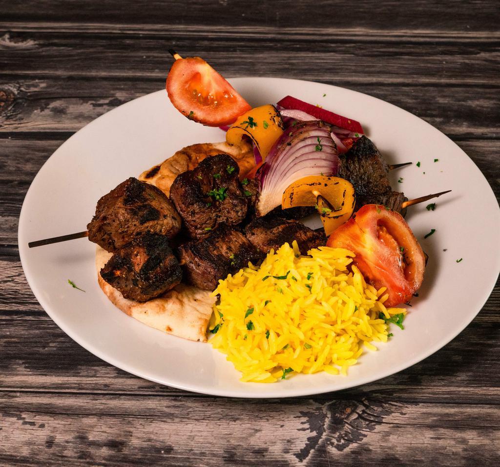 Beef Shish Kabab · Lean and tender beef charcoal grilled. Served with rice and tahini sauce.