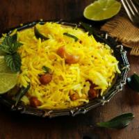 Lemon Rice · Basmati rice infused with a zesty lemon sauce seasoned with cumin, red chili, cilantro, curr...