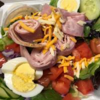 Chef Salad · Turkey, ham, cheddar, mixed greens, tomatoes, cucumbers, green olives, and hard-boiled eggs.