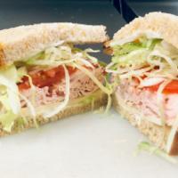 Ham and Cheese Sandwich · Smoked ham, provolone, lettuce, vine ripe tomato, and mayonnaise.