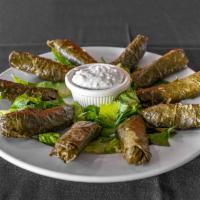 Mahshi Special Dish · 11 grape leaves dolmas stuffed with meat and rice and served with a house salad and yogurt s...