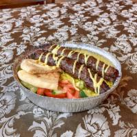Kafta Kebab Entree · Grilled ground choice beef and lamb mixed with diced onions, parsley, and seasoned with our ...