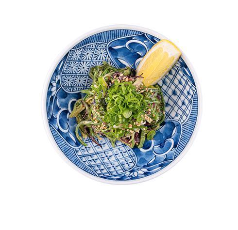 Kaiso Seaweed Salad · Hiyashi wakame, sesame dressing, green onion, and lemon. Vegan.