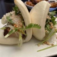 2 Taiwan Sliders · Braised pork belly, candied peanuts, pickled root vegetables, cilantro, steamed lotus buns.