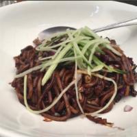 Zha Jiang Mian · Fresh noodles, minced pork, cucumbers, squash, caramelized onions, black bean sauce.
