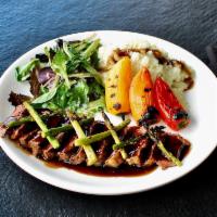 Steak Teriyaki · Charred broil ribeye steak red wine reduction sauce, grilled asparagus, tri color sweet pepp...