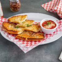 Garlic Bread  · Buttery bread that is topped with garlic. 
