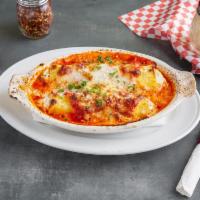 Cannelloni  · Tubes of pasta filled with beef, Italian sausage, spinach, ricotta and mozzarella. 