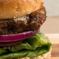 Black Bean Veggie Burger · Grilled Black Bean Burger, Romaine Lettuce, Tomato, Red Onion, Topped with Spicy Tomatillo S...